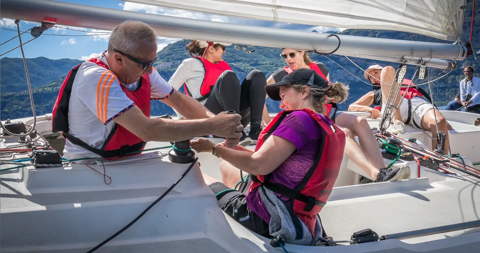 Groupwork on winch on sailboat in Malcesine